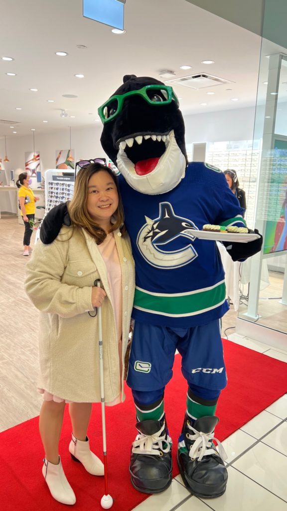 Anne with Fin the Whale, Mascot of the Vancouver Canucks